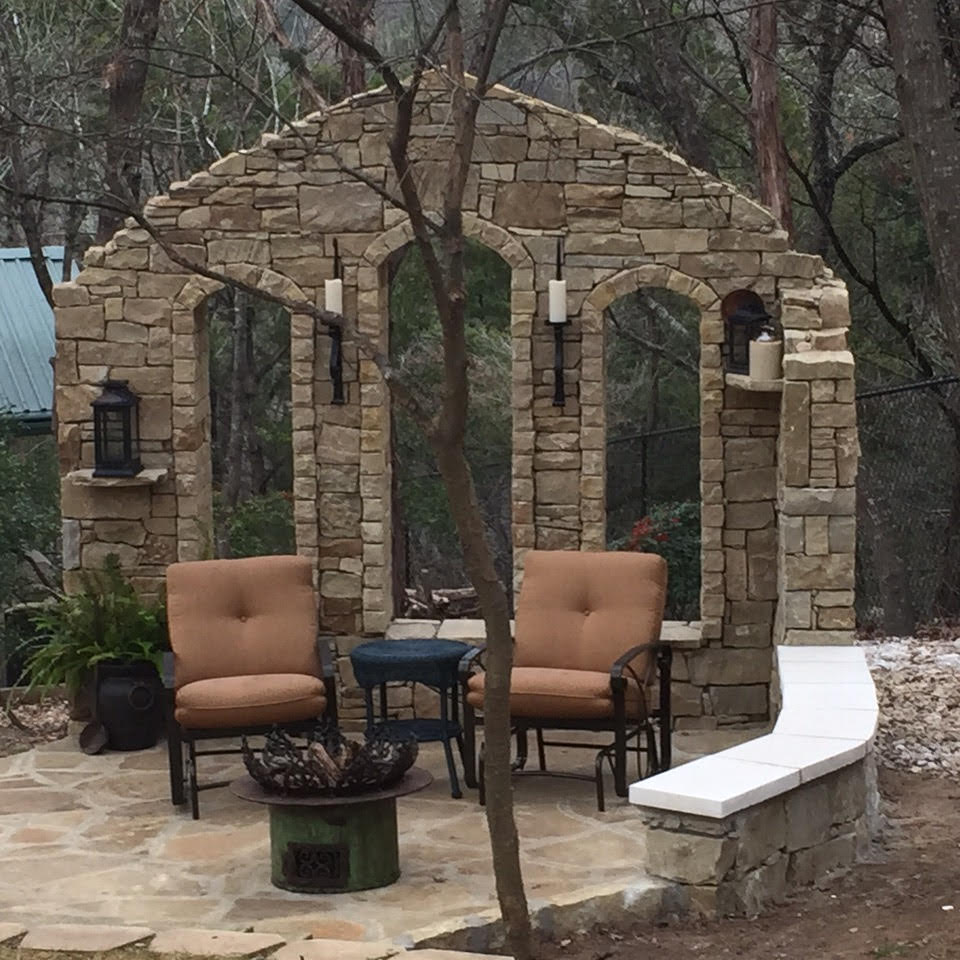 Custom stone fireplace and chimney built by Texas Stone Masons in the Hill Country